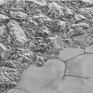 Mountains of ice along a portion of smoother ice planes on Pluto's surface.